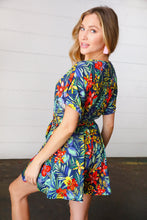Load image into Gallery viewer, Navy Tropical Floral Surplice Romper-Modish Lily, Tecumseh Michigan
